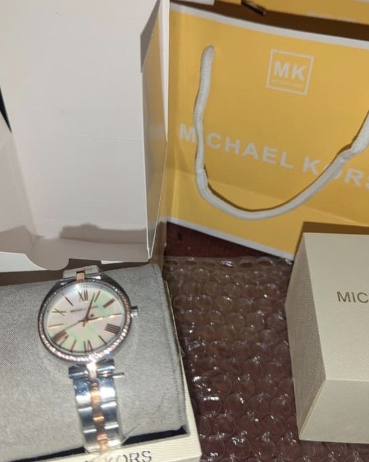 Michael Kors watch with its box and bag